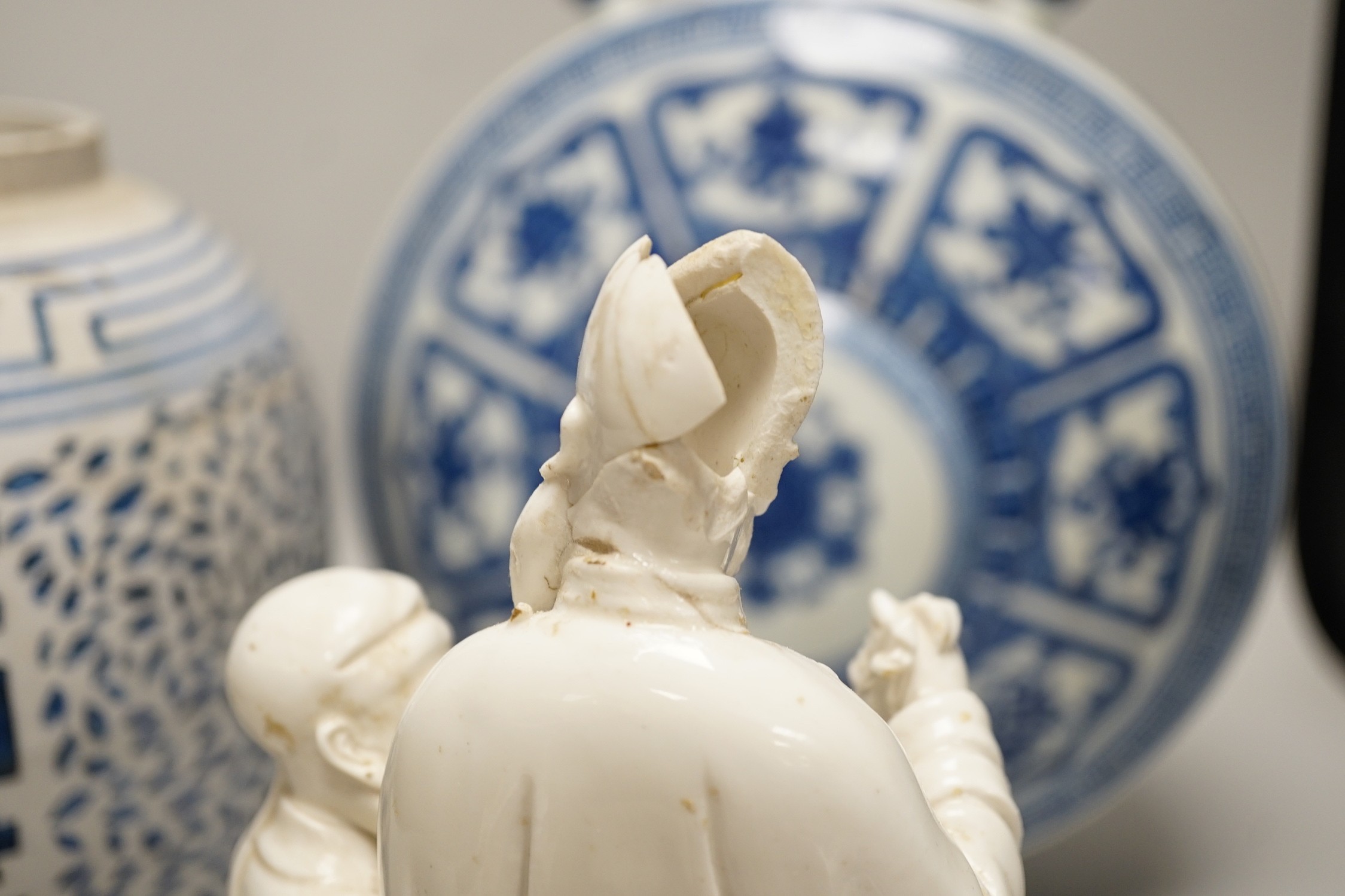 A Chinese blue and white two handled moonflask, together with another Chinese vase and Chinese figure group, tallest 36cm